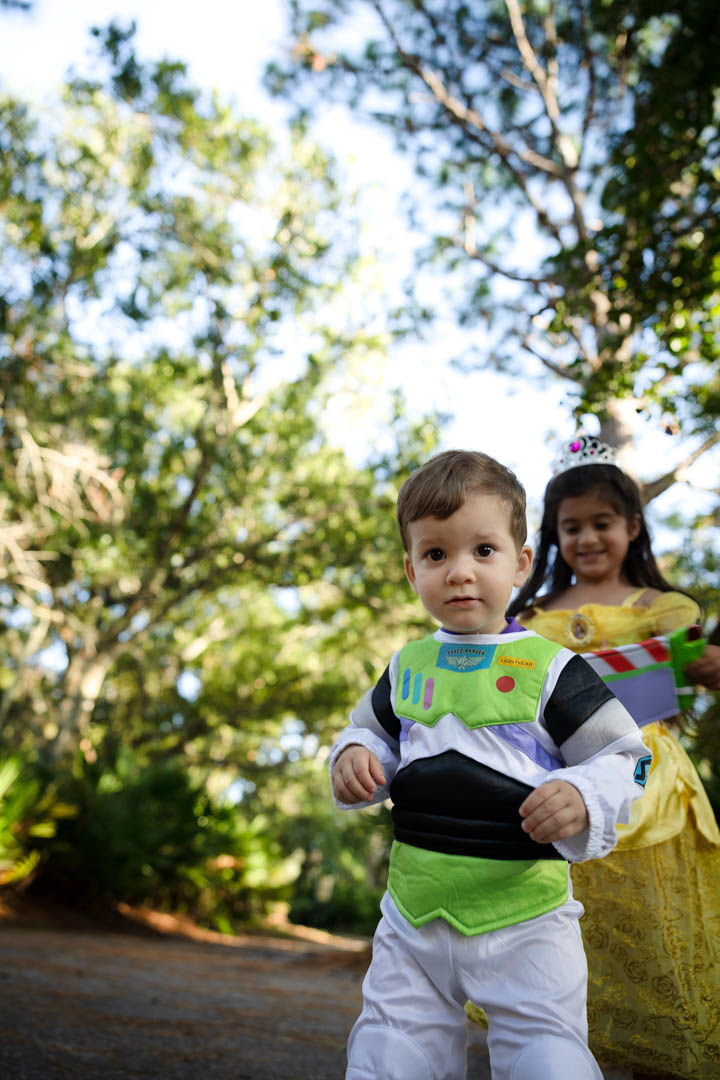 Brother and sister running in costume