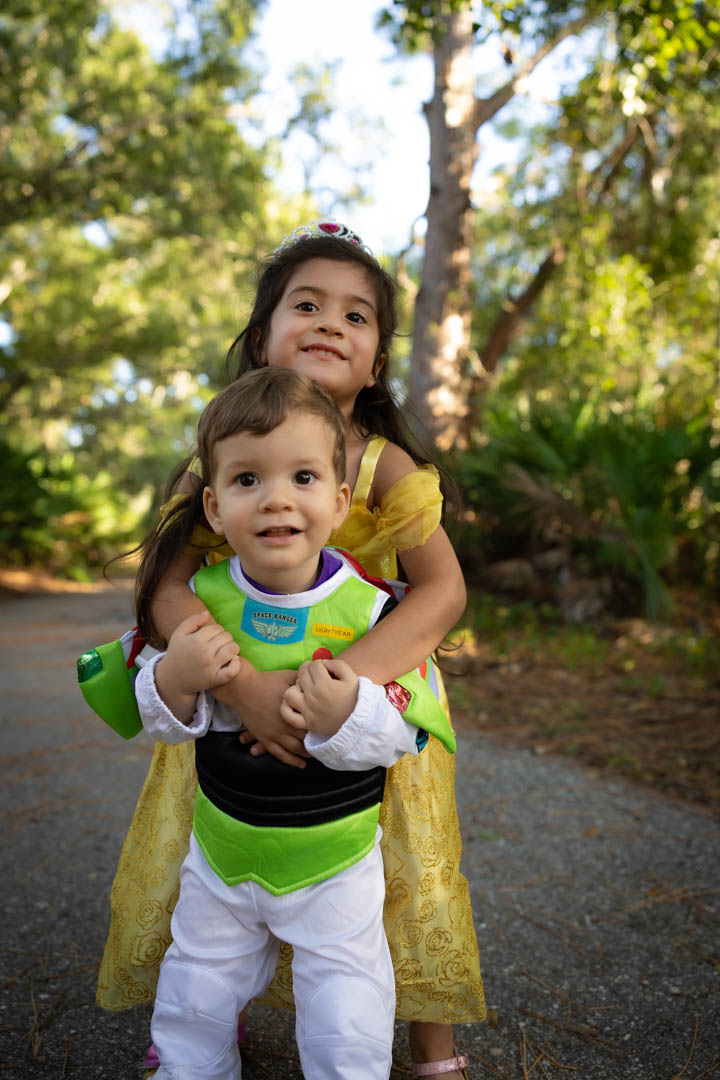 Brother and sister posing in costume
