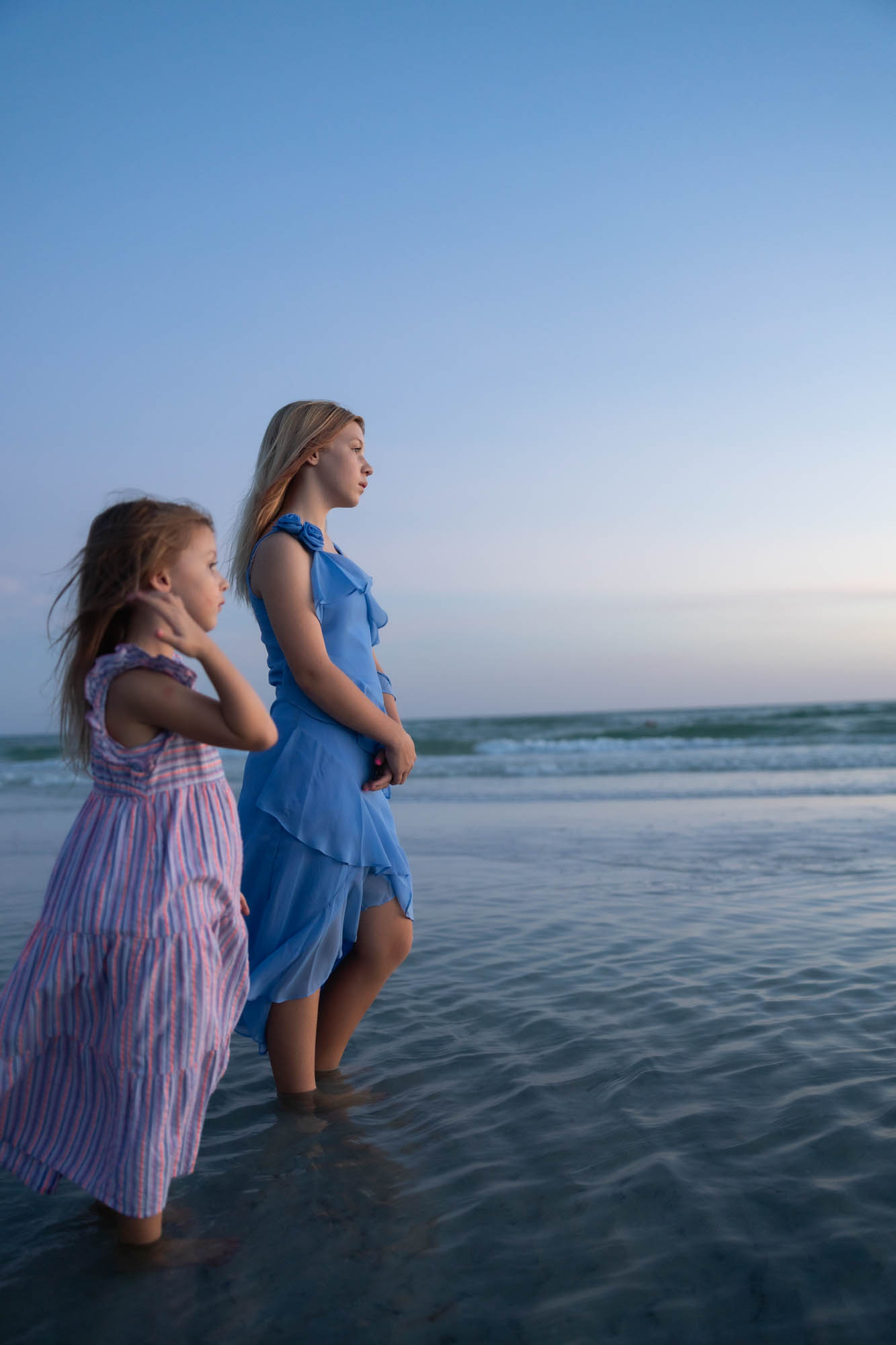 Watching the waves, backs to camera