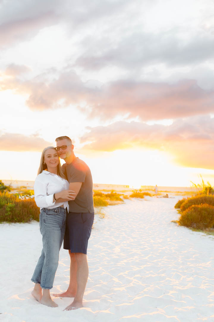 Couple laughing together at Lido, warm golden light